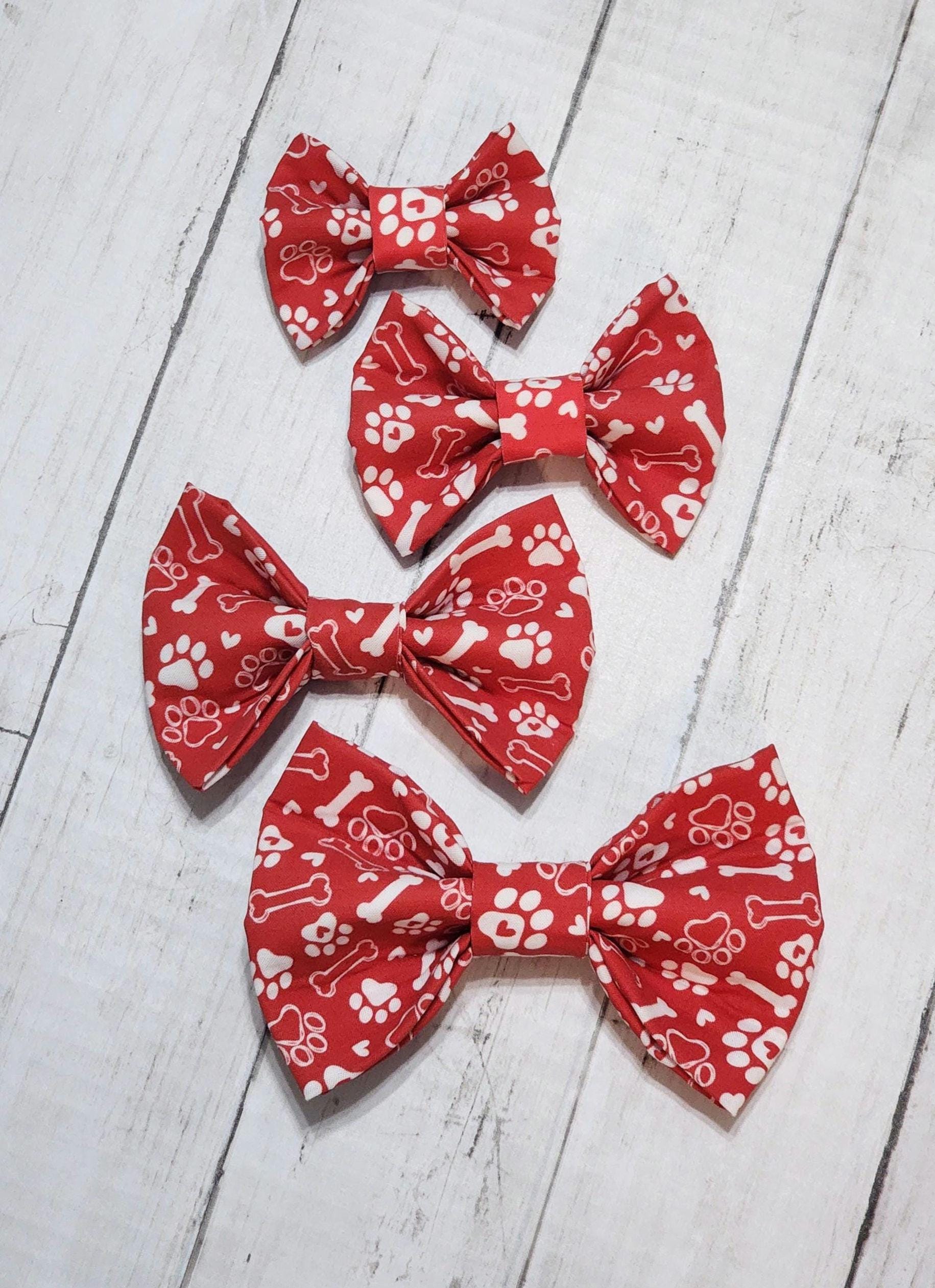 Red Dog Bow Tie With White Paws and Bones