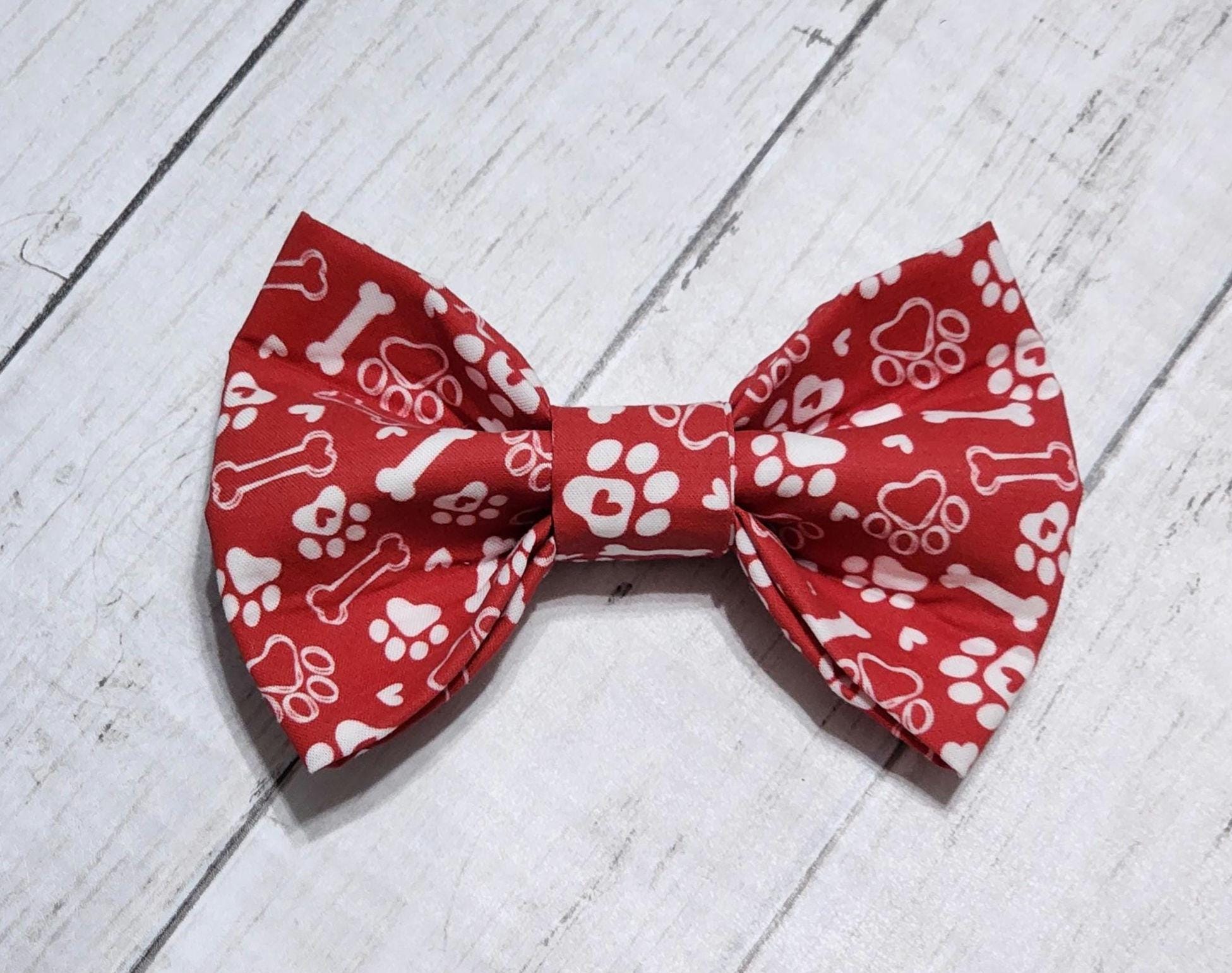 Red Dog Bow Tie With White Paws and Bones